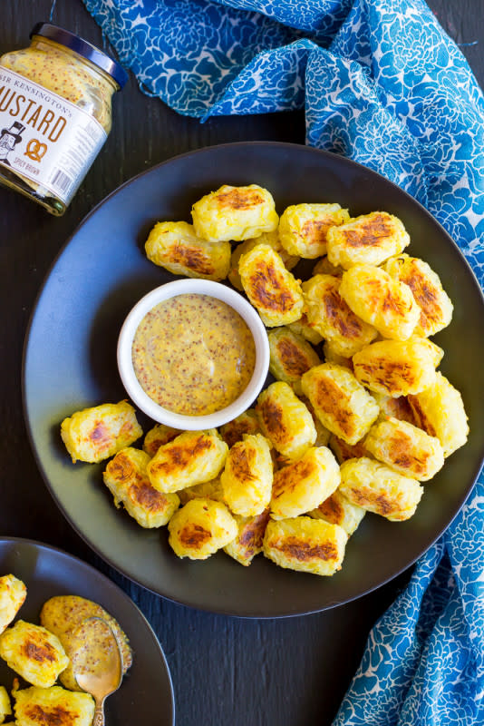 <p>She Likes Food</p><p>Spaghetti squash and potatoes mixed together in a delicious seasonal tater tot recipe!</p><p><a href="http://www.shelikesfood.com/1/post/2015/12/spaghetti-squash-tater-tots-maple-mustard-dip.html" rel="nofollow noopener" target="_blank" data-ylk="slk:Get the recipe here!;elm:context_link;itc:0;sec:content-canvas" class="link "><em><strong>Get the recipe here!</strong></em></a></p>