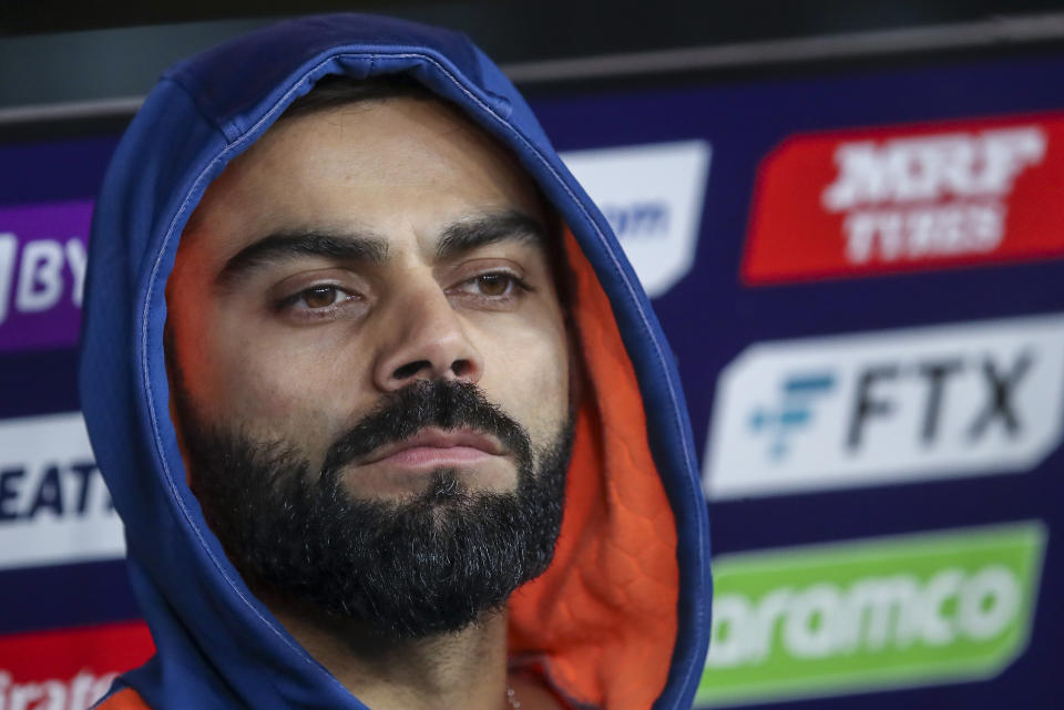 India's Virat Kohli watches play from the players dugout during the T20 World Cup cricket match between the India and South Africa in Perth, Australia, Sunday, Oct. 30, 2022. (AP Photo/Gary Day)