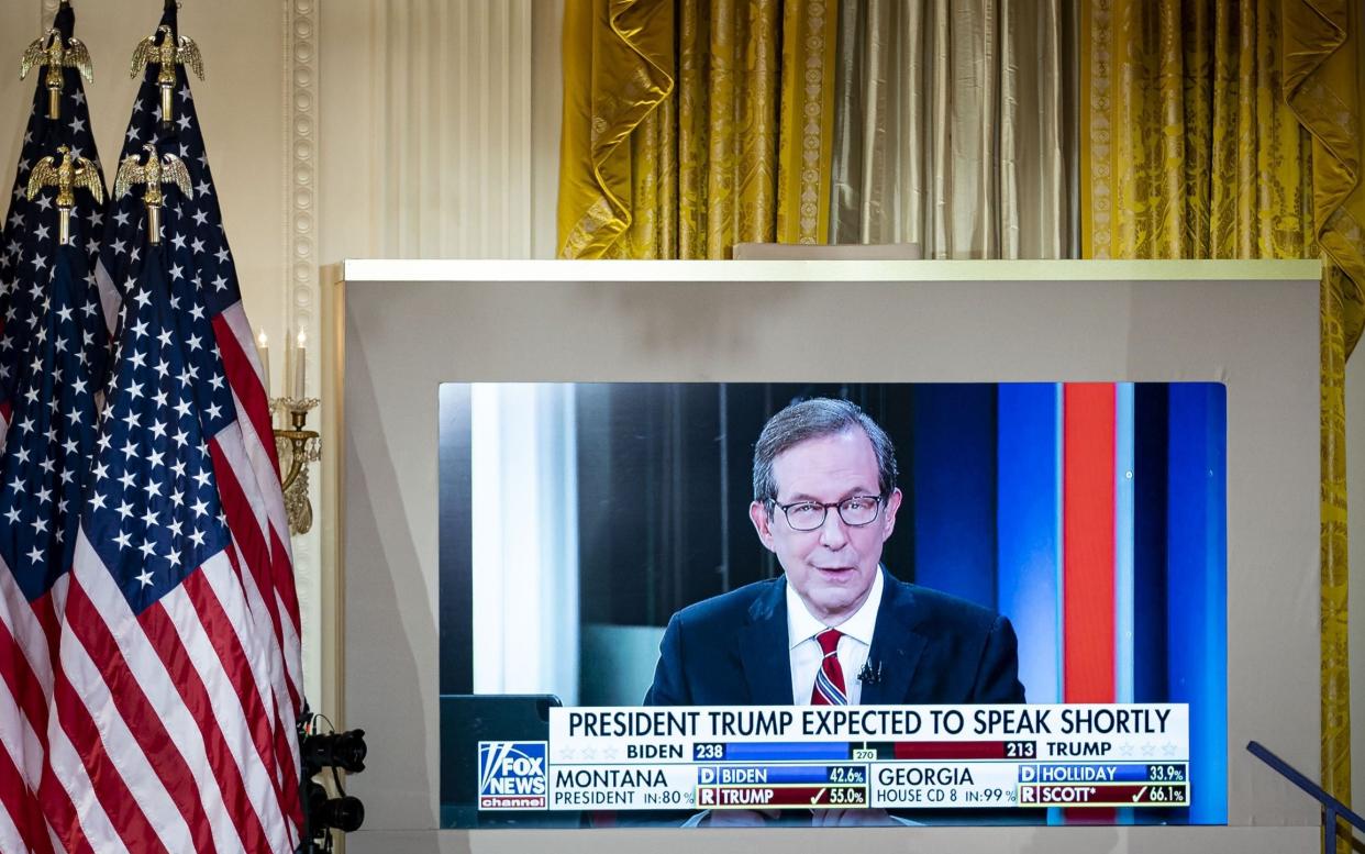 A TV in the White House shows Fox News coverage on election night - Al Drago/ Bloomberg