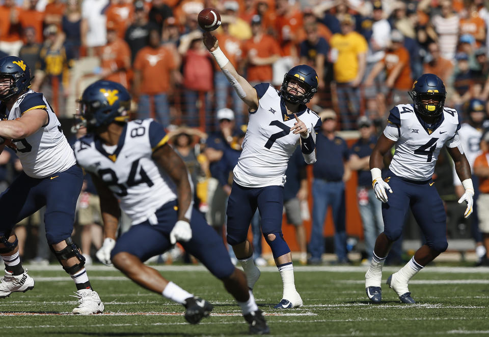 Will Grier threw for three TDs against Texas. (Getty)