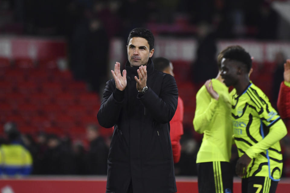 Arsenal's manager Mikel Arteta waves his supporters at the end of the English Premier League soccer match between Nottingham Forest and Arsenal at the City Ground stadium in Nottingham, England, Tuesday, Jan. 30, 2024. Arsenal won 2-1. (AP Photo/Rui Vieira)