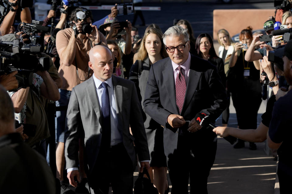 Actor Alec Baldwin, right, arrives for his hearing in Santa Fe County District Court with attorney Luke Nikas, Wednesday, July 10, 2024, in Santa Fe, N.M. Baldwin is facing a single charge of involuntary manslaughter in the death of a cinematographer. (AP Photo/Ross D. Franklin)