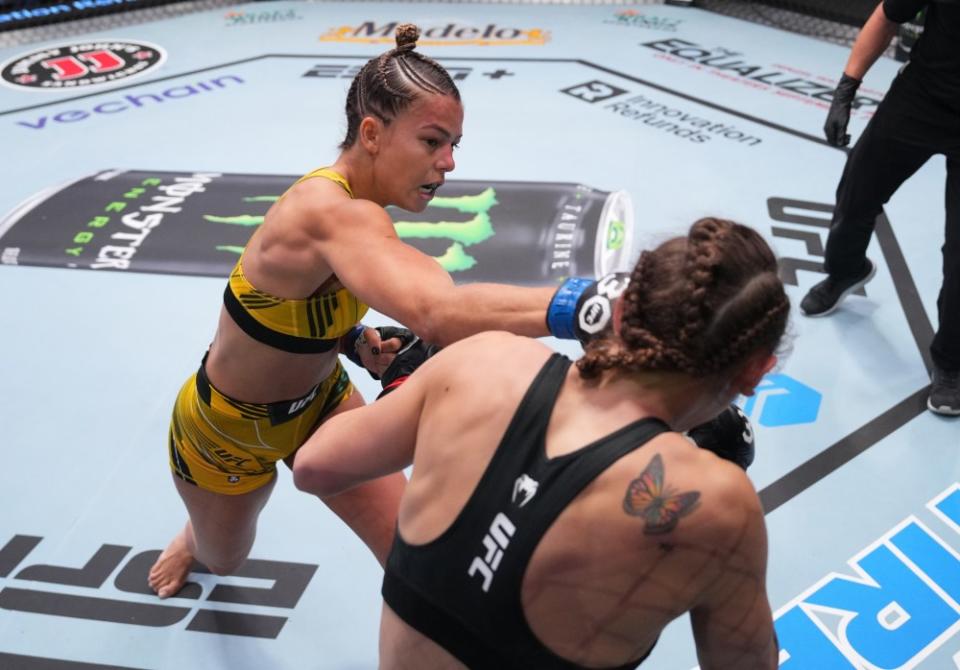 LAS VEGAS, NEVADA – AUGUST 12: (L-R) Luana Santos of Brazil punches Juliana Miller in a flyweight fight during the UFC Fight Night event at UFC APEX on August 12, 2023 in Las Vegas, Nevada. (Photo by Al Powers/Zuffa LLC via Getty Images)