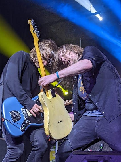 Ryan Smith, left, and Dave Pirner of Soul Asylum team up to play guitar near the end of Friday night's concert at the Goss Opera House.