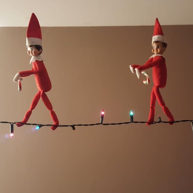 46) Elf on the Shelf walking a tightrope