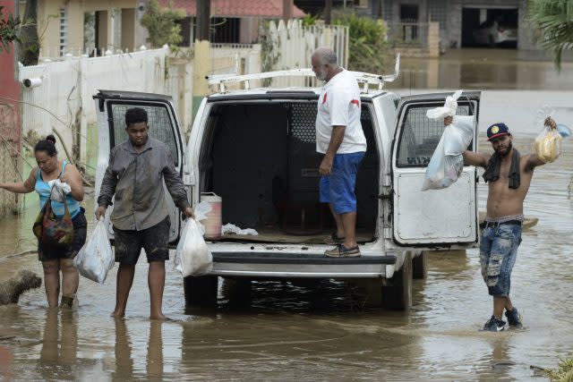 Residents after Hurricane Maria hit Puerto Rico. ( Carlos Giusti/AP/PA)