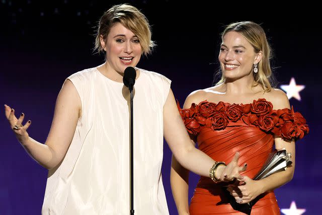 <p>Kevin Winter/Getty</p> Greta Gerwig and Margot Robbie accept 'Barbie's best comedy win at 2024 Critics Choice Awards.