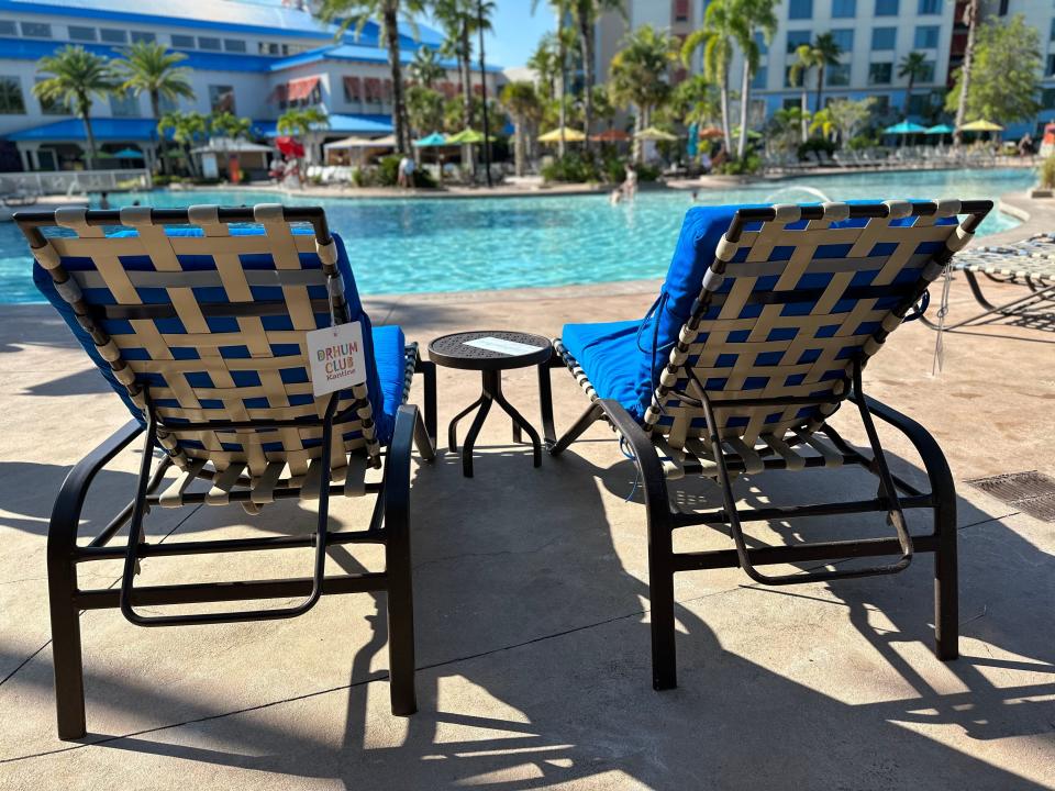 two pool loungers at the pool at Loews Sapphire Falls Resort in universal orlando