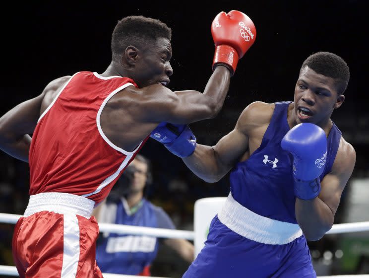 Gary Russell (R) dispatched Haiti's Richardson Hitchins on Wednesday. (AP)
