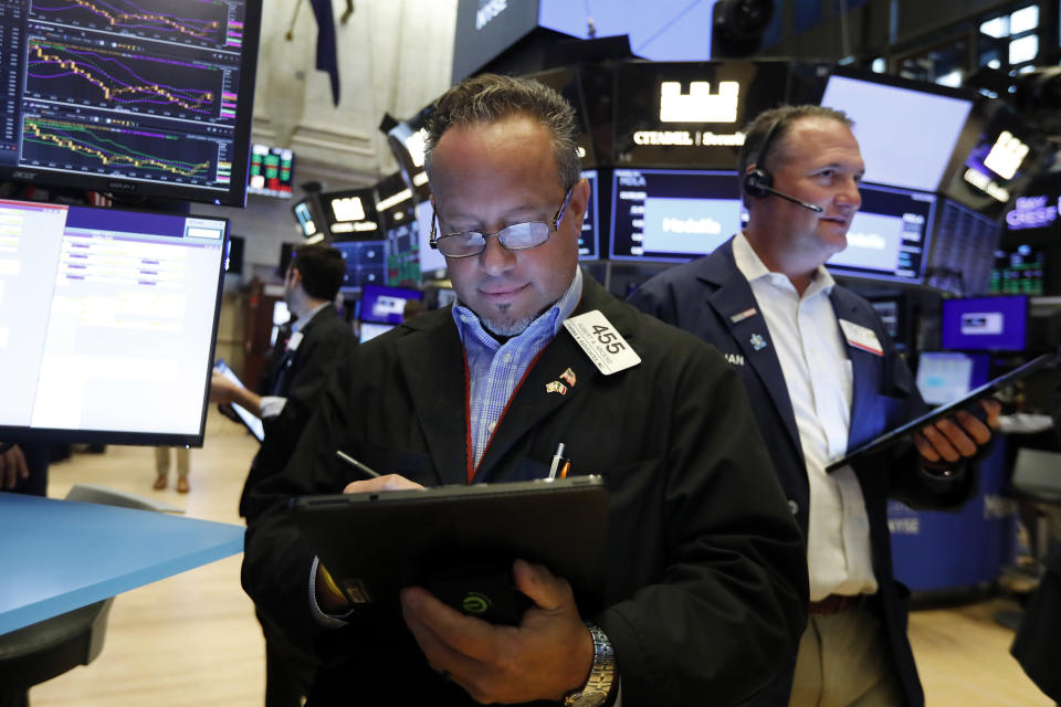 Trader Robert Arciero works on the floor of the New York Stock Exchange, Friday, July 19, 2019. U.S. stocks moved broadly higher in early trading on Wall Street Friday and chipped away at the week's losses. (AP Photo/Richard Drew)