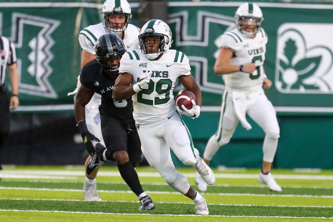 Portland State running back Jalynnee McGee (29) runs the ball during the first half of an NCAA college football game against the Hawaii, Saturday, Sept. 4, 2021, in Honolulu. (AP Photo/Darryl Oumi)