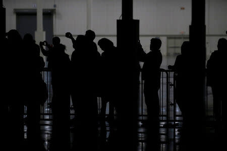 Supporters rally with Republican presidential nominee Donald Trump at the Suburban Collection Showplace in Novi, Michigan, U.S. September 30, 2016. REUTERS/Jonathan Ernst