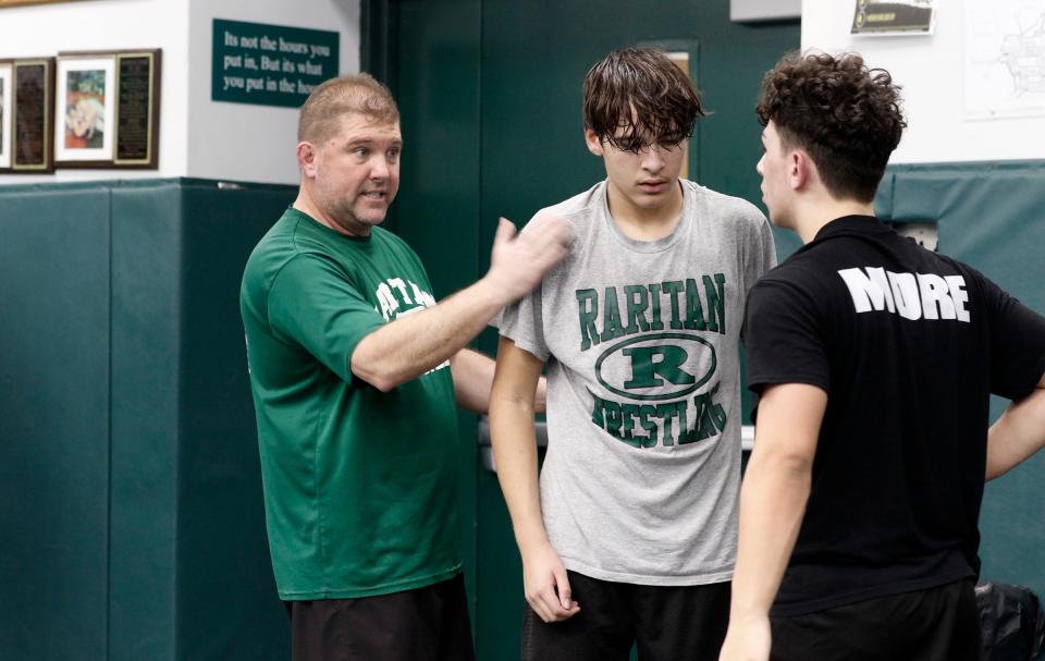 Raritan High School head wrestling coach Rob Nucci (left) is in his final season as the Rockets' head coach.