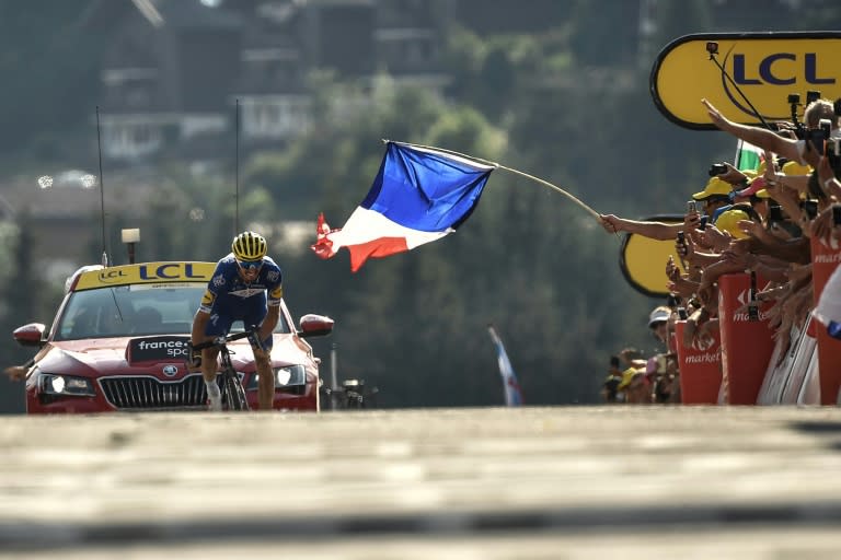 A tricolor greets France's Julian Alaphilippe at the finish of Tuesday's 10th stage
