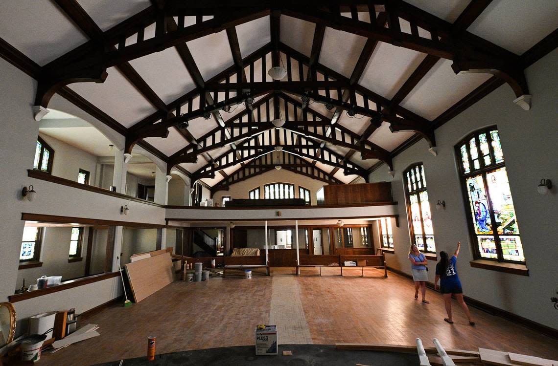 Damaris Kunkler, right, takes a friend on a tour of a century-old church building that’s being renovated into Revival Music Hall, a concert venue slated to open next year.