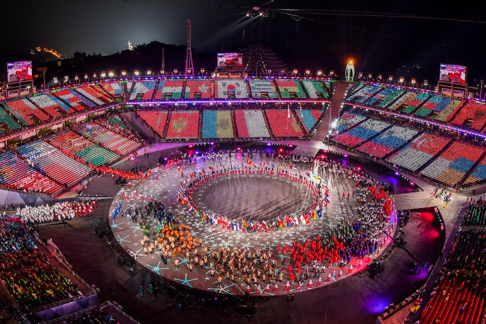 <p>General view of images of flags being projected on the stands as athletes enter the stadium during the closing ceremony of the Pyeongchang 2018 Winter Olympic Games at the Pyeongchang Stadium on February 25, 2018. / AFP PHOTO / François-Xavier MARIT </p>