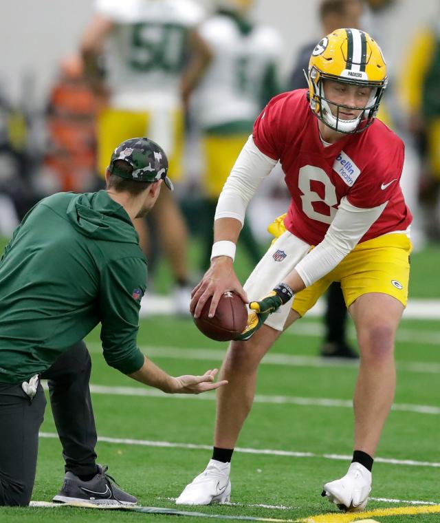 Sean Clifford shows off his brand new official Green Bay Packers