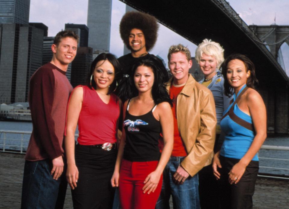Group photo of "The Real World: Brooklyn" cast with the Brooklyn Bridge in the background