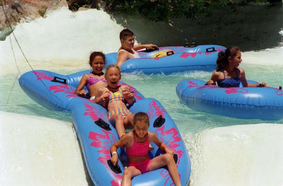 In this June 1999 photo, Kristy Coddle, 10, Vanessa Grijalvara, 10, and Felicia Grijalvara, 11, anticipate a drop in the Rapids ride at the Manteca Waterslides park.