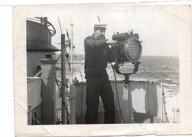 A young Andy Barber stands at the signal station aboard HMCS Haida during its Pacific deployment following the armistice in the Korean conflict.