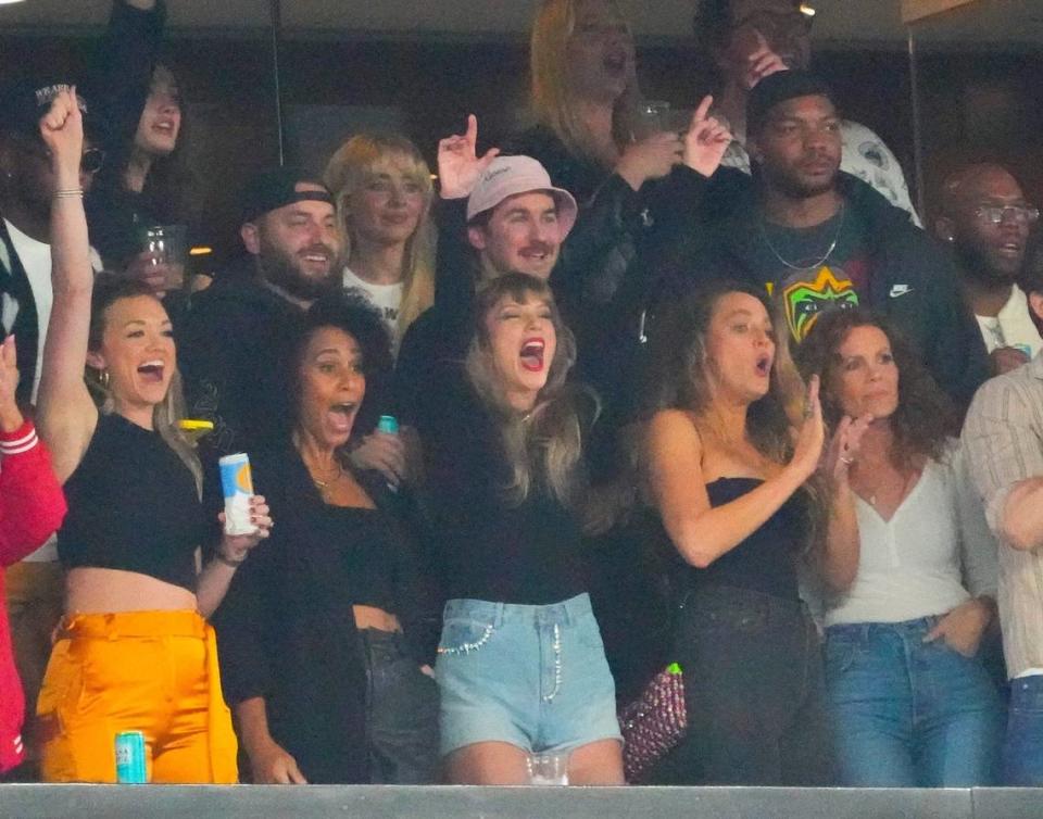 Taylor Swift, a guest of Kansas City Chiefs tight end Travis Kelce, cheers during the “Sunday Night Football” game against the New York Jets at MetLife Stadium. Swift reportedly made a secret trip to Kansas City last week, according to tabloids.