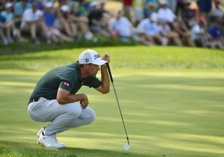 Aug 11, 2018; Saint Louis, MO, USA; Adam Scott lines up a putt on the 15th green during the third round of the PGA Championship golf tournament at Bellerive Country Club. Mandatory Credit: Jeff Curry-USA TODAY Sports