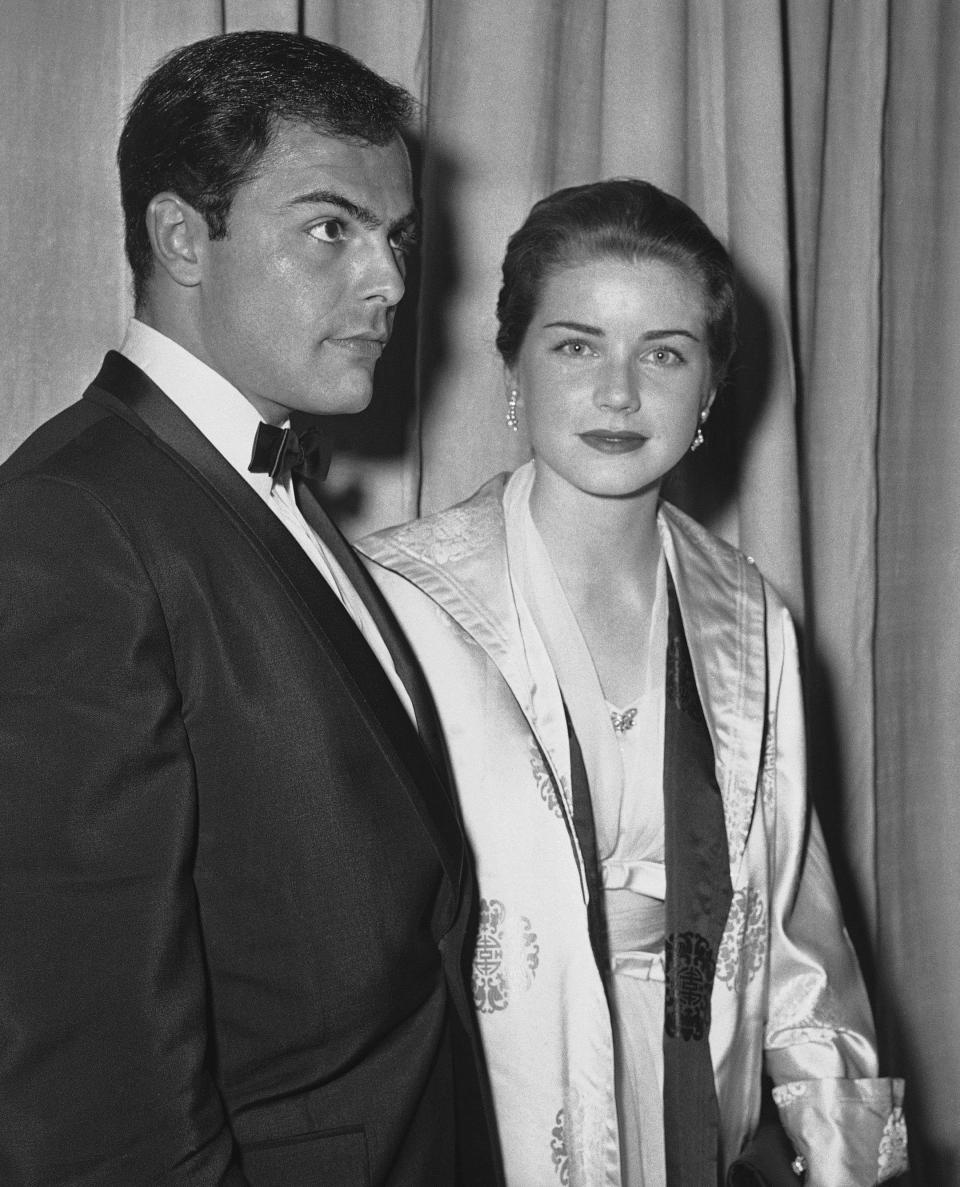 FILE - In this April 4, 1960 file photo, actor John Saxon and actress Dolores Hart arrive at Pantages Theater in Hollywood, Calif., for the Academy Awards show. Hart, whose luminous blue eyes entranced Elvis Presley in his first on-screen movie kiss, is now a cloistered nun and praying for a Christmas miracle. She walked away from Hollywood stardom in 1963 to become a nun in rural Bethlehem, Conn. Now she finds herself back in the spotlight, but this time it's all about serving the King of Kings, not smooching the King of Rock and Roll. The former brass factory that houses Mother Dolores and about 40 other nuns cloistered at the Abbey of Regina Laudis in Bethlehem, Conn., needs millions of dollars in renovations to meet fire and safety codes, add an elevator and make handicap accessibility upgrades. (AP Photo, File)