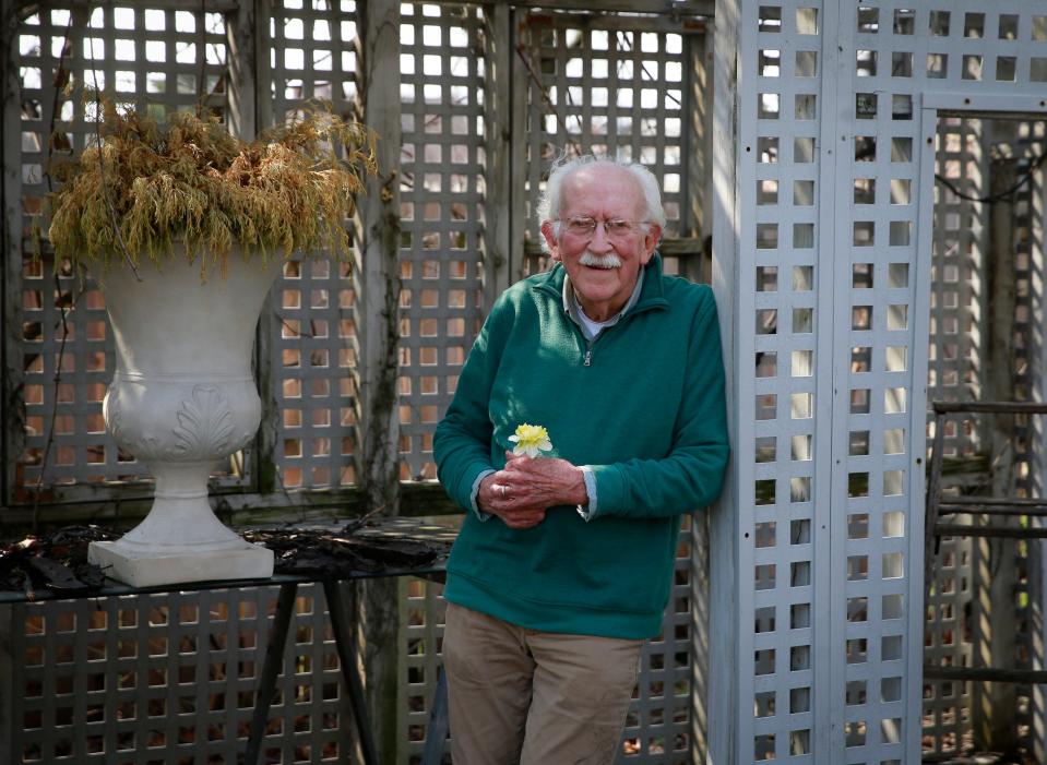 Des Moines gardener and gardening writer Elvin McDonald spends time in his West Des Moines yard on Friday, April 22, 2022.