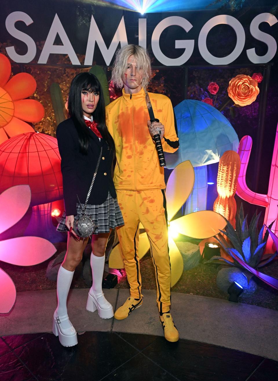 Megan Fox and Machine Gun Kelly attend a Halloween party.