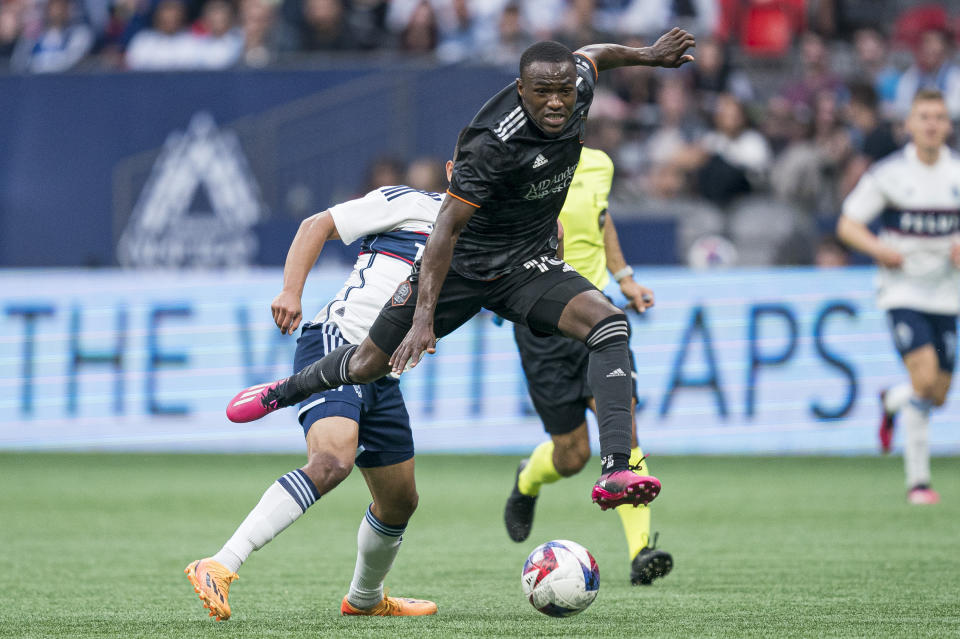 Houston Dynamo's Ibrahim Aliyu, front, avoids Vancouver Whitecaps FC's Mathias Laborda during the first half of an MLS soccer match Wednesday, May 31, 2023, in Vancouver, British Columbia. (Rich Lam/The Canadian Press via AP)