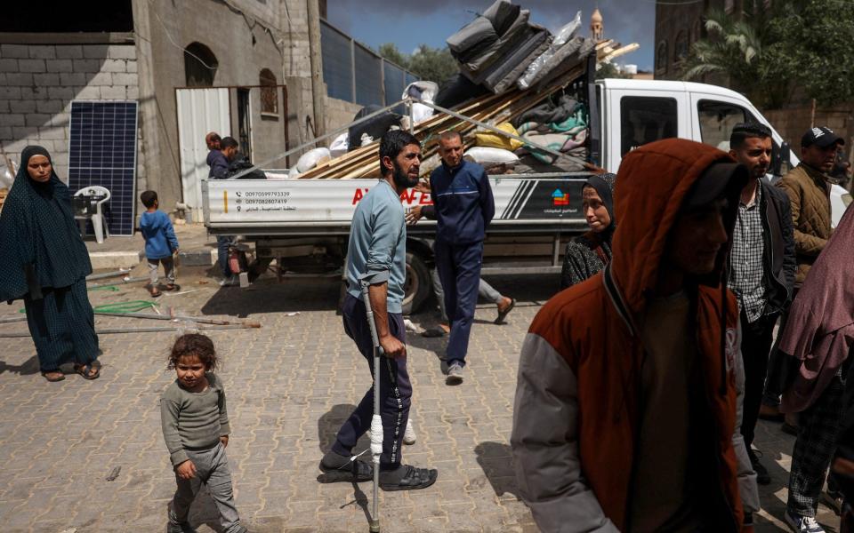 Displaced Palestinians in Rafah in the southern Gaza Strip pack their belongings in a truck following an evacuation order by the Israeli army