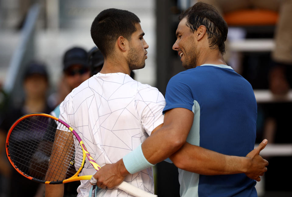 Tennis - ATP Masters 1000 - Madrid Open - Caja Magica, Madrid, Spain - May 6, 2022 Spain's Carlos Alcaraz Garfia with Spain's Rafael Nadal after their quarter final match REUTERS/Juan Medina