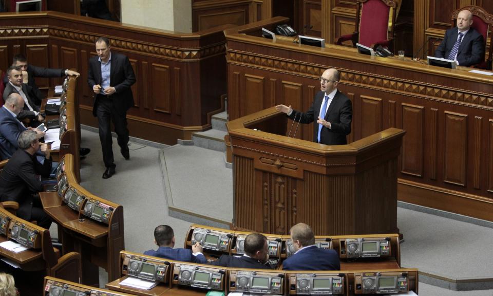 Ukrainian Prime Minister Arseniy Yatsenyuk, speaks to lawmakers during a session at the Ukrainian parliament in Kiev, Ukraine, Thursday, March. 27, 2014. (AP Photo/Sergei Chuzavkov)