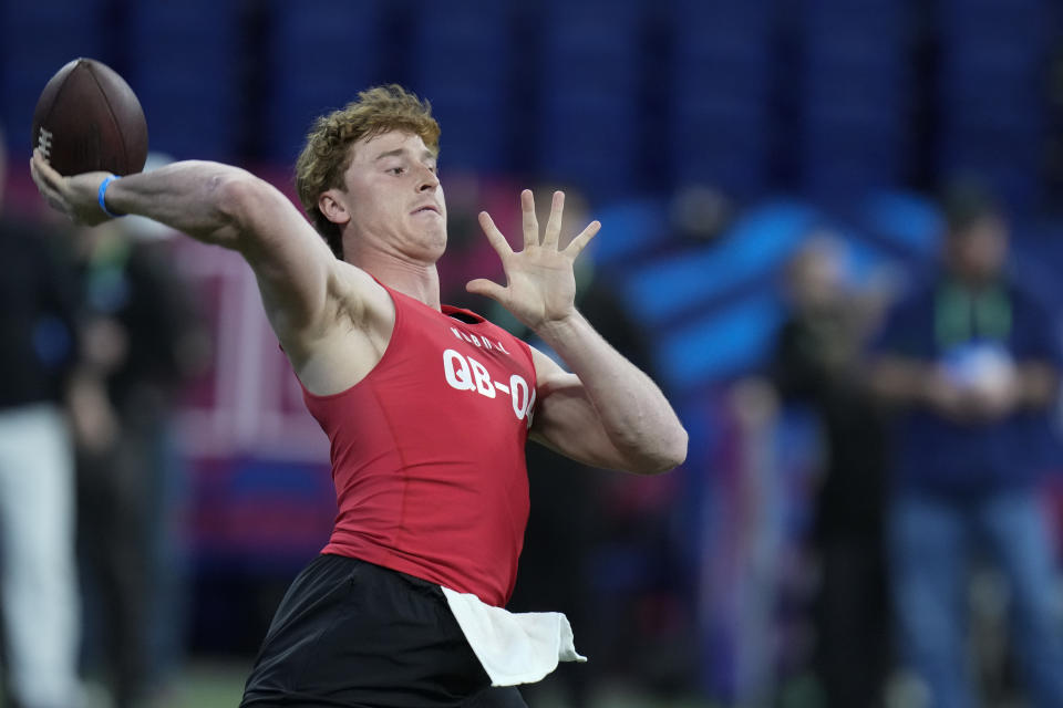 FILE - TCU quarterback Max Duggan runs a drill at the NFL football scouting combine in Indianapolis, Saturday, March 4, 2023. In the first nine drafts after former sixth-round pick Tom Brady won his first Super Bowl following the 2002 season, there were an average of seven QBs taken in the final three rounds of the draft. (AP Photo/Michael Conroy, File)