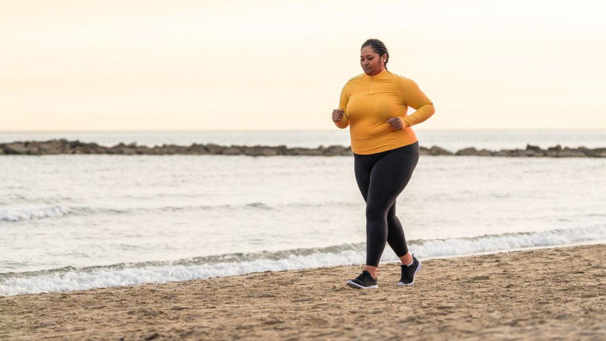 Female running on a beach.