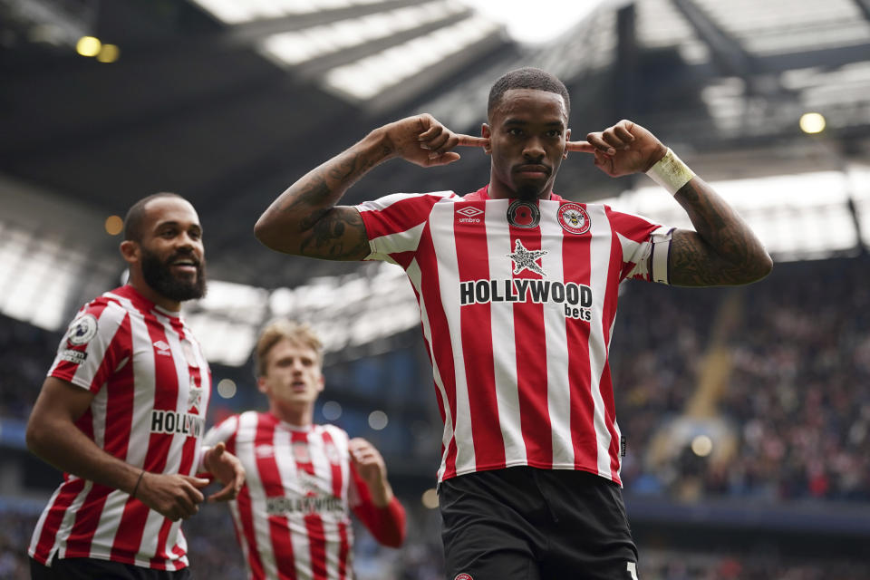 Brentford's Ivan Toney celebrates after scoring his side's first goal during the English Premier League soccer match between Manchester City and Brentford, at the Etihad stadium in Manchester, England, Saturday, Nov.12, 2022. (AP Photo/Dave Thompson)