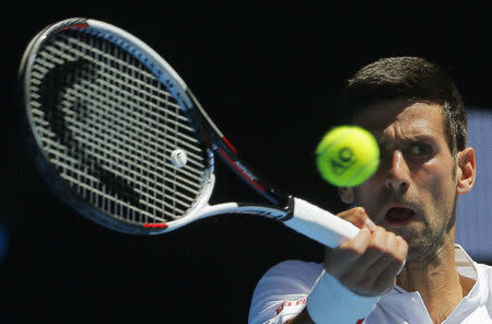 Serbia's Novak Djokovic hits a shot during his Men's singles second round match against Uzbekistan's Denis Istomin. REUTERS/Jason Reed