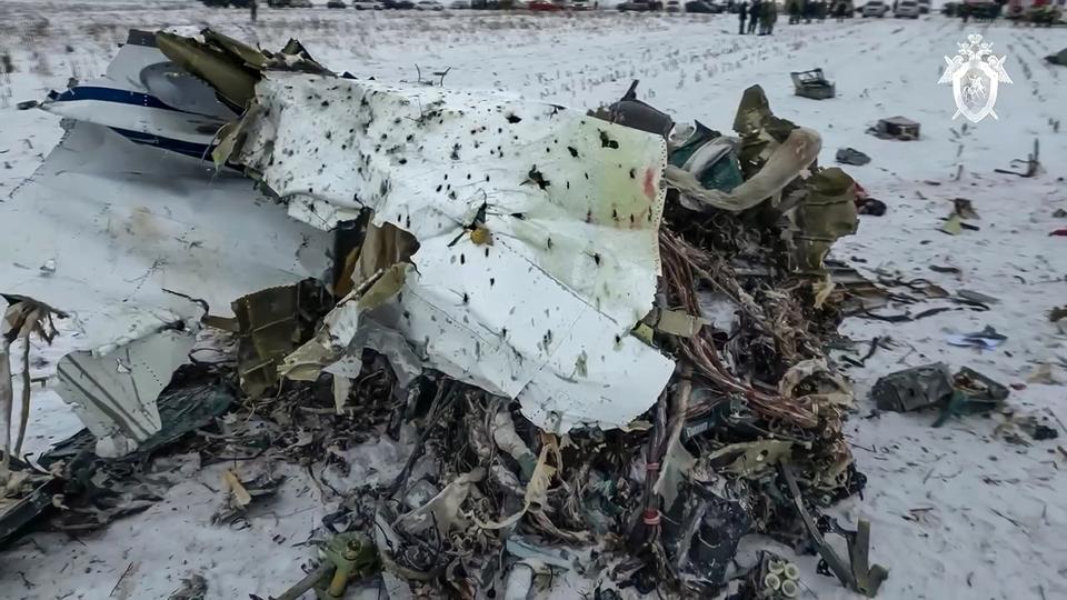 In this photo from a video released by the Russian Investigative Committee on Thursday, Jan. 25, 2024, wreckage of a Russian military transport plane that crashed a day earlier near Yablonovo, in the Belgorod region of Russia near the border with Ukraine. The Russian Defense Ministry said the plane, carrying Ukrainian prisoners of war, was shot down by Ukraine. Officials in Kyiv didn't contest that the plane went down but argued that Moscow had failed to say in advance it was carrying POWs. (Russian Investigative Committee via AP)