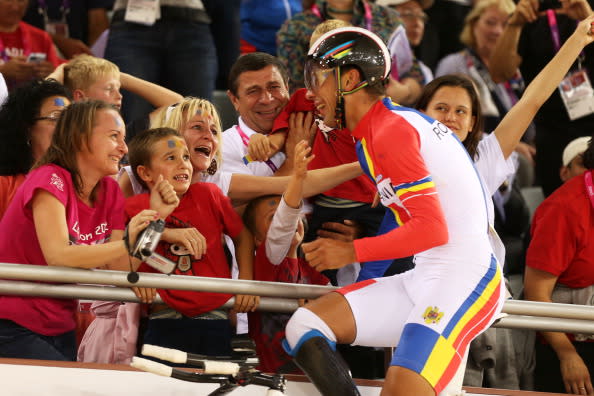 Carol-Eduard Novak of Romania celebrates winning gold in Men's Individual C4 Pursuit Final on day 3 of the London 2012 Paralympic Games at Velodrome on September 1, 2012 in London, England. (Photo by Bryn Lennon/Getty Images)