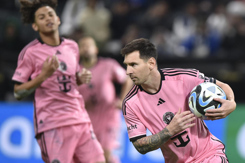 Inter Miami's Lionel Messi runs with the ball during the Riyadh Season Cup soccer match between Inter Miami and Al Hilal at Kingdom Arena Stadium in Riyadh, Saudi Arabia, Monday, Jan. 29, 2024. (AP Photo)