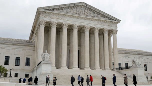 PHOTO: People walk across the plaza of the U.S. Supreme Court building on the first day of the court's new term in Washington, D.C., Oct. 3, 2022.  (Jonathan Ernst/Reuters)