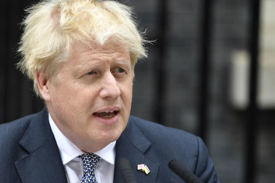 Prime Minister Boris Johnson reads a statement outside 10 Downing Street, London, formally resigning as Conservative Party leader after ministers and MPs made clear his position was untenable