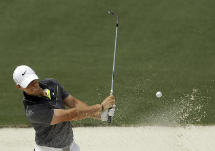 Rory McIlroy, of Northern Ireland, hits out of a bunker on the second hole during the second round of the Masters golf tournament Friday, April 10, 2015, in Augusta, Ga. (AP Photo/Darron Cummings)