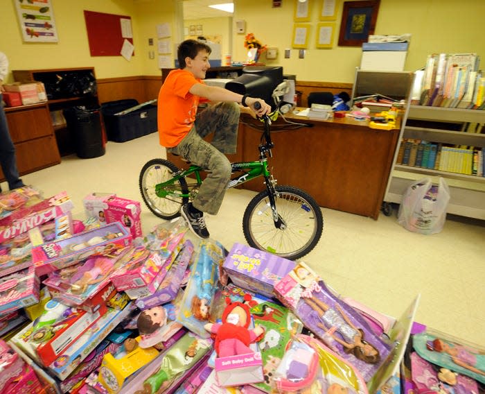 Patrick Sullivan/Times-News
22-December-2012
Jordan Jakubielski, 12, volunteers as he checks out a bike as they prepare of the annual Bounty of Bethlehem dinner on Christmas Day at Immaculata School Saturday. Volunteers will spend the next few days preparing food and wrapping presents for the annual event. Dinner will be served from 1 to 5 p.m. on Christmas Day.