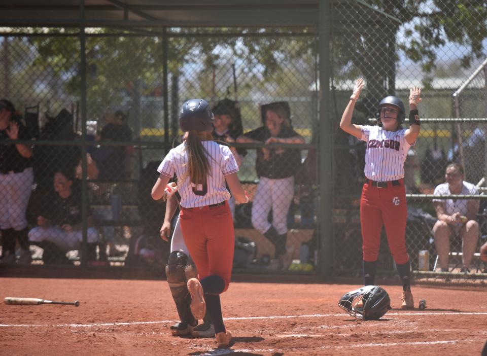 Emma Shakespear crosses home during Crimson Cliffs' win over Desert Hills on Wednesday.