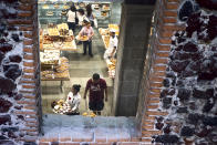 <p>People fill trays of pastries at a sweets shop. Mexico has a very high level of child obesity cases, and an increasing rate of type 2 diabetes among children. (Photograph by Silvia Landi) </p>