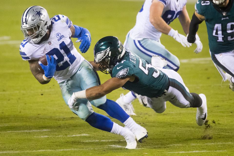 Dallas' Ezekiel Elliot (21) is wrapped up by the Eagles' T.J. Edwards Sunday, Nov. 1, 2020, at Lincoln Financial Field. 