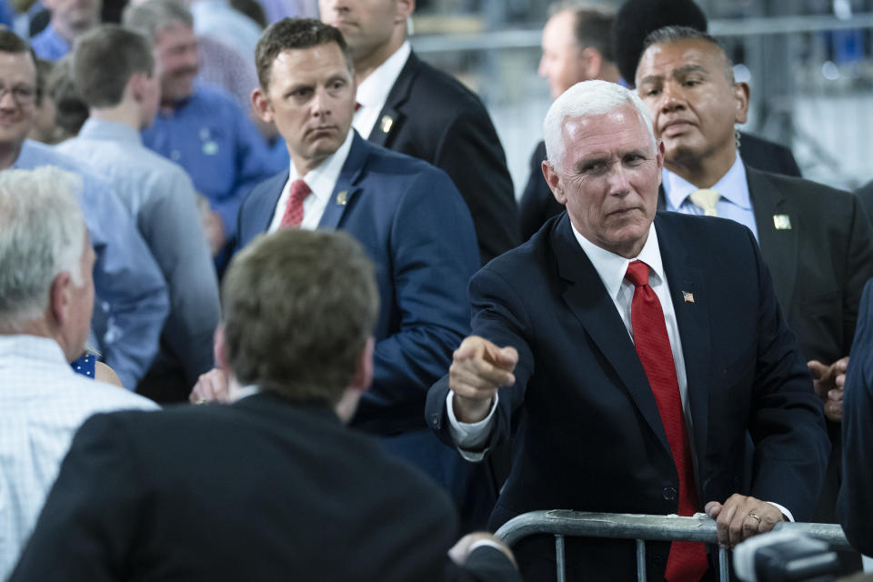 In this June 6, 2019, photo, Vice President Mike Pence meets with attendees at JLS Automation in York, Pa. (AP Photo/Matt Rourke)