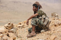 Soldier loyal to Yemen's President Abd-Rabbu Mansour Hadi sit near an area of frontline of fighting against Houthi rebels in Makhdara area of Marib province, Yemen June 28, 2017. Picture taken June 28, 2017. REUTERS/Ali Owidha