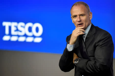 FILE PHOTO: Tesco Group Chief Executive, Dave Lewis speaks at an analyst presentation in London, Britain, April 12, 2017. REUTERS/Hannah McKay /File Photo